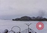 Image of American submarine waits in bay for commandos Pacific Theater, 1944, second 52 stock footage video 65675076122