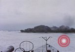Image of American submarine waits in bay for commandos Pacific Theater, 1944, second 53 stock footage video 65675076122