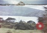 Image of US commandos set explosives on island Pacific Theater, 1944, second 1 stock footage video 65675076123