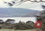 Image of US commandos set explosives on island Pacific Theater, 1944, second 3 stock footage video 65675076123
