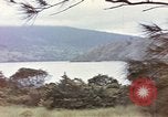 Image of US commandos set explosives on island Pacific Theater, 1944, second 4 stock footage video 65675076123