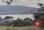 Image of US commandos set explosives on island Pacific Theater, 1944, second 15 stock footage video 65675076123