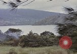 Image of US commandos set explosives on island Pacific Theater, 1944, second 18 stock footage video 65675076123