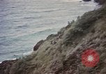 Image of US commandos set explosives on island Pacific Theater, 1944, second 25 stock footage video 65675076123