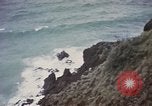 Image of US commandos set explosives on island Pacific Theater, 1944, second 27 stock footage video 65675076123