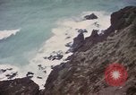 Image of US commandos set explosives on island Pacific Theater, 1944, second 28 stock footage video 65675076123