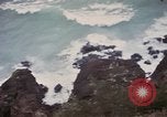 Image of US commandos set explosives on island Pacific Theater, 1944, second 30 stock footage video 65675076123