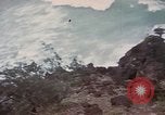 Image of US commandos set explosives on island Pacific Theater, 1944, second 33 stock footage video 65675076123
