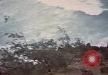 Image of US commandos set explosives on island Pacific Theater, 1944, second 34 stock footage video 65675076123