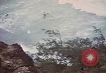 Image of US commandos set explosives on island Pacific Theater, 1944, second 35 stock footage video 65675076123