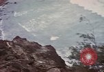 Image of US commandos set explosives on island Pacific Theater, 1944, second 36 stock footage video 65675076123