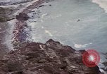 Image of US commandos set explosives on island Pacific Theater, 1944, second 37 stock footage video 65675076123