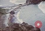 Image of US commandos set explosives on island Pacific Theater, 1944, second 38 stock footage video 65675076123