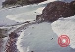 Image of US commandos set explosives on island Pacific Theater, 1944, second 39 stock footage video 65675076123
