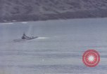 Image of US commandos set explosives on island Pacific Theater, 1944, second 40 stock footage video 65675076123