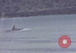 Image of US commandos set explosives on island Pacific Theater, 1944, second 42 stock footage video 65675076123
