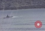 Image of US commandos set explosives on island Pacific Theater, 1944, second 43 stock footage video 65675076123
