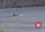 Image of US commandos set explosives on island Pacific Theater, 1944, second 48 stock footage video 65675076123