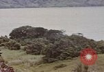 Image of US commandos set explosives on island Pacific Theater, 1944, second 61 stock footage video 65675076123