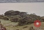 Image of US commandos set explosives on island Pacific Theater, 1944, second 62 stock footage video 65675076123