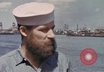 Image of US submarine crews and Japanese POWs disembarking Pearl Harbor Hawaii USA, 1944, second 15 stock footage video 65675076128