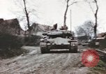 Image of U.S. armor and troops pass through town near end of World War II Germany, 1945, second 8 stock footage video 65675076290