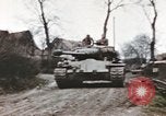 Image of U.S. armor and troops pass through town near end of World War II Germany, 1945, second 10 stock footage video 65675076290