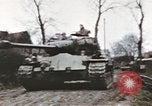 Image of U.S. armor and troops pass through town near end of World War II Germany, 1945, second 12 stock footage video 65675076290