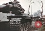 Image of U.S. armor and troops pass through town near end of World War II Germany, 1945, second 14 stock footage video 65675076290