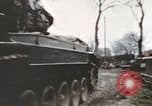 Image of U.S. armor and troops pass through town near end of World War II Germany, 1945, second 15 stock footage video 65675076290