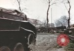 Image of U.S. armor and troops pass through town near end of World War II Germany, 1945, second 16 stock footage video 65675076290