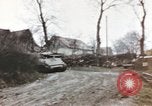 Image of U.S. armor and troops pass through town near end of World War II Germany, 1945, second 17 stock footage video 65675076290