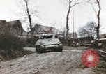 Image of U.S. armor and troops pass through town near end of World War II Germany, 1945, second 20 stock footage video 65675076290
