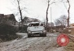 Image of U.S. armor and troops pass through town near end of World War II Germany, 1945, second 21 stock footage video 65675076290