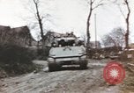 Image of U.S. armor and troops pass through town near end of World War II Germany, 1945, second 22 stock footage video 65675076290
