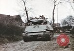 Image of U.S. armor and troops pass through town near end of World War II Germany, 1945, second 23 stock footage video 65675076290