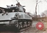 Image of U.S. armor and troops pass through town near end of World War II Germany, 1945, second 25 stock footage video 65675076290