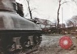 Image of U.S. armor and troops pass through town near end of World War II Germany, 1945, second 26 stock footage video 65675076290