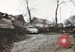 Image of U.S. armor and troops pass through town near end of World War II Germany, 1945, second 27 stock footage video 65675076290