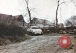 Image of U.S. armor and troops pass through town near end of World War II Germany, 1945, second 28 stock footage video 65675076290