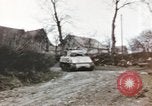 Image of U.S. armor and troops pass through town near end of World War II Germany, 1945, second 29 stock footage video 65675076290