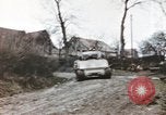 Image of U.S. armor and troops pass through town near end of World War II Germany, 1945, second 31 stock footage video 65675076290