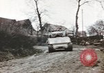 Image of U.S. armor and troops pass through town near end of World War II Germany, 1945, second 32 stock footage video 65675076290