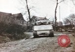 Image of U.S. armor and troops pass through town near end of World War II Germany, 1945, second 33 stock footage video 65675076290