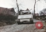 Image of U.S. armor and troops pass through town near end of World War II Germany, 1945, second 34 stock footage video 65675076290