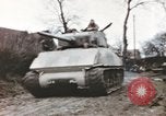 Image of U.S. armor and troops pass through town near end of World War II Germany, 1945, second 35 stock footage video 65675076290