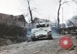 Image of U.S. armor and troops pass through town near end of World War II Germany, 1945, second 41 stock footage video 65675076290