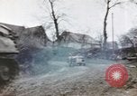 Image of U.S. armor and troops pass through town near end of World War II Germany, 1945, second 44 stock footage video 65675076290