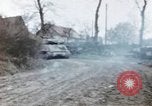 Image of U.S. armor and troops pass through town near end of World War II Germany, 1945, second 45 stock footage video 65675076290