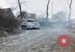 Image of U.S. armor and troops pass through town near end of World War II Germany, 1945, second 46 stock footage video 65675076290